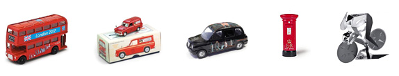 Two London buses, Royal Mail model van on top of box, black taxi and a red post box.