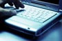 Typing on laptop