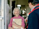 Postman chatting to woman