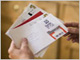 Person holding mail