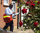 Postman delivering mail