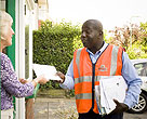Postman delivering mail to lady