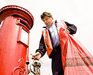 Mailman emptying mail box