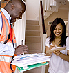Postman delivering mail to lady