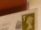 First class stamp on envelope
