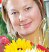 Girl holding a bunch of flowers