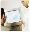 two men looking at a computer screen