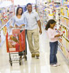 A family in a supermarket aisle