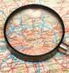 Magnifying glass resting on a map of London