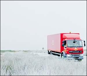 Lorry delivering mail through snow