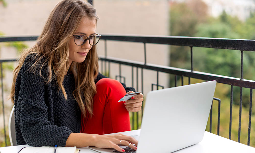 Woman on laptop online shopping