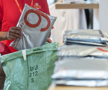 A delivery man holding parcel